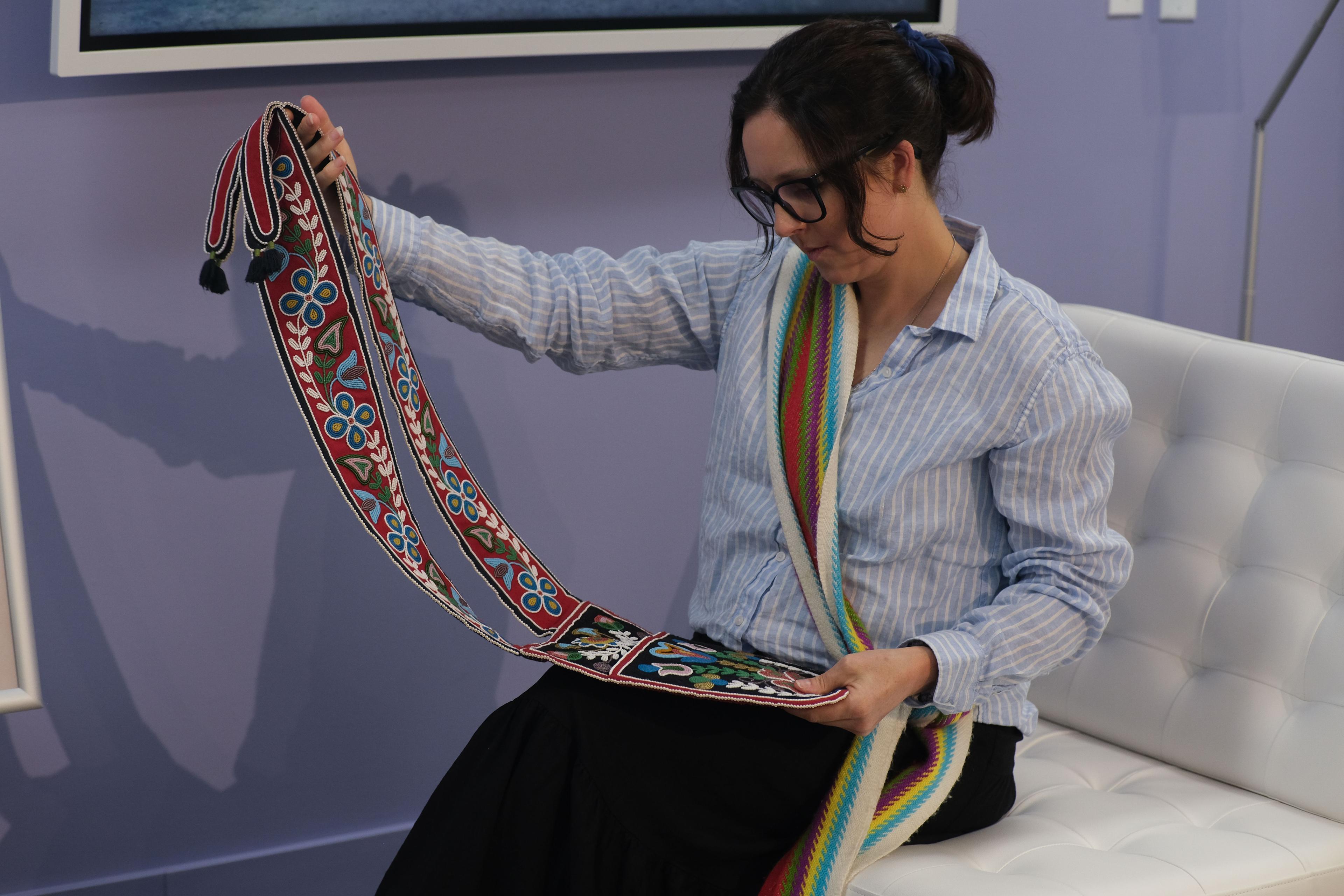Woman holding Métis Artifact